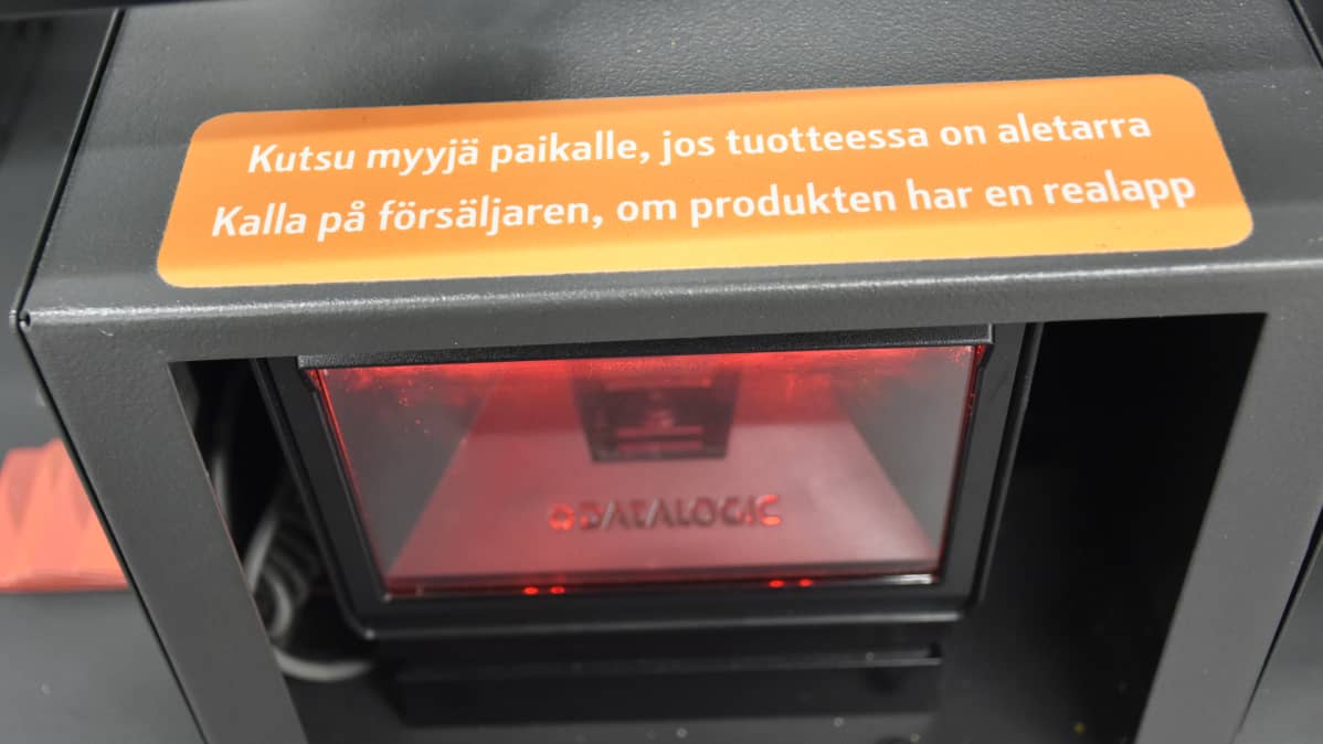 Kuvassa opaste itsepalvelukassalla