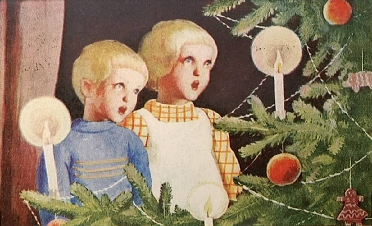 Lapset laulavat joulukuusen äärellä.