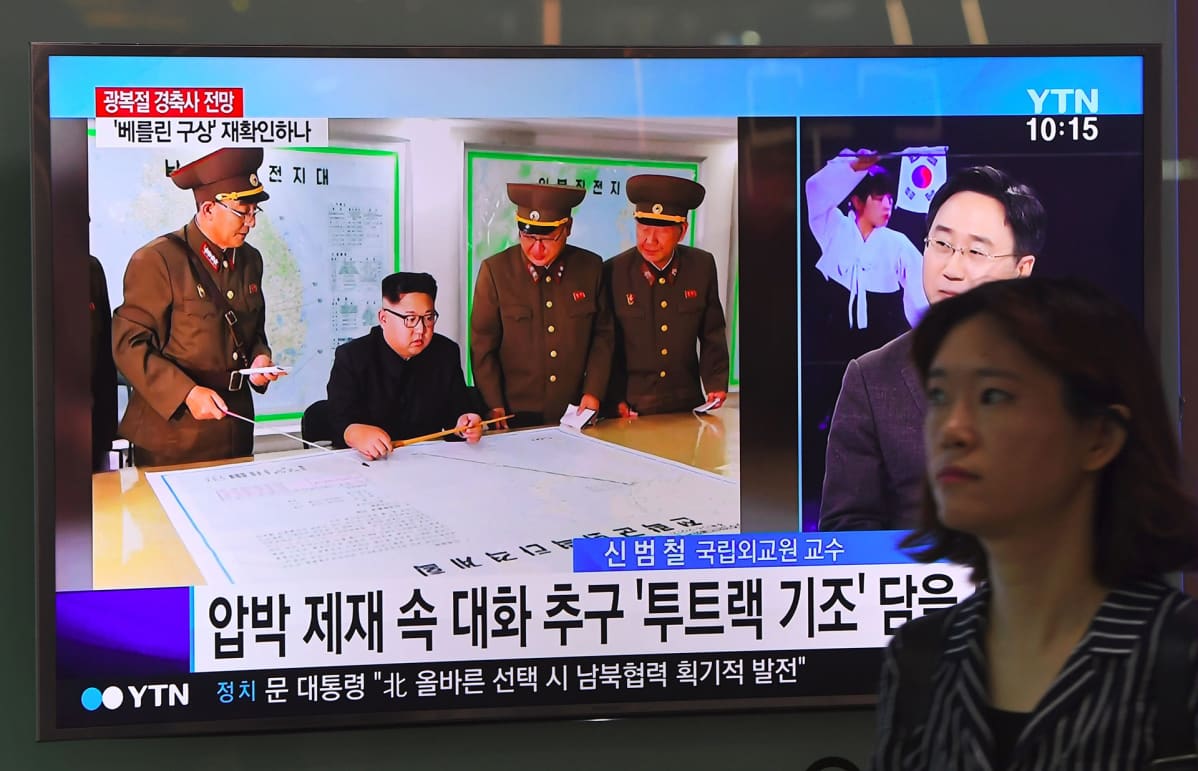 Pohjoiskorean Kim Jong-Un Pohjois-Korean televisiolähetyksessä.