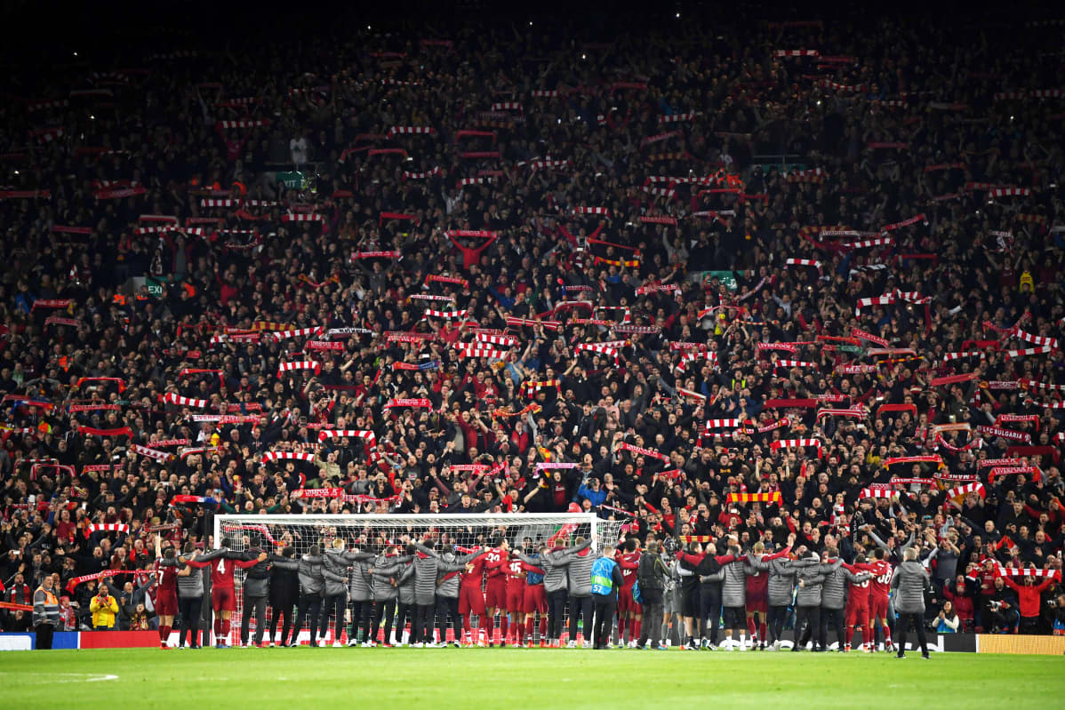 Liverpool players celebrate with fans after the UEFA Champions League Semi Final second leg match between Liverpool and Barcelona at Anfield on May 07, 2019 in Liverpool, England.