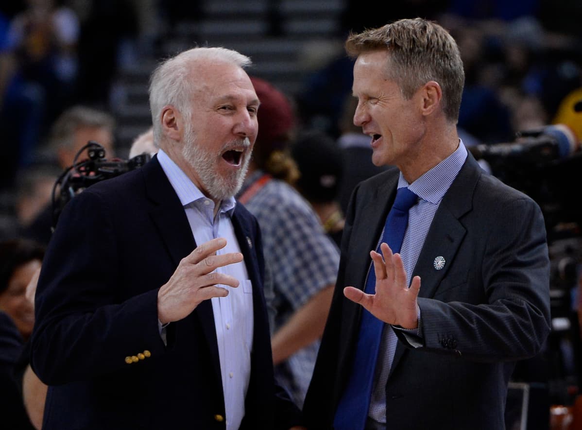 Steve Kerr (oik.) voitti Gregg Popovichin (vas.) alaisuudessa mestaruuden vuonna 2003. Nykyisin Kerr valmentaa Golden State Warriorsia.