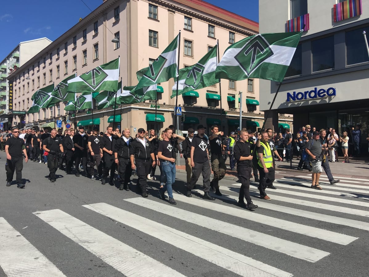 Nordic Resistance Movement marchers chant "Free speech!" in Turku on 18 August 2018.