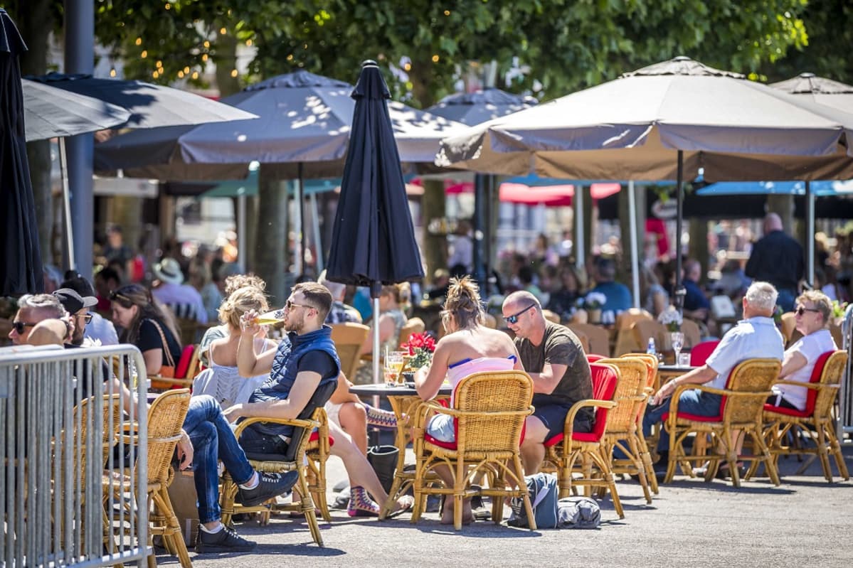 Guests on a terrace at the Vrijthof in Maastricht, The Netherlands, 01 June 2020. Measures to combat the spread of the COVID-19 coronavirus have been relaxed, which include the gathering of groups, catering, education and cultural institutions. EPA-EFE/MARCEL VAN HOORN