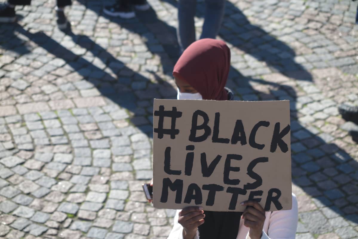 A participant holds a sign reading "black lives matter" at an anti-racism demonstration held in Helsinki on 3 June 2020.