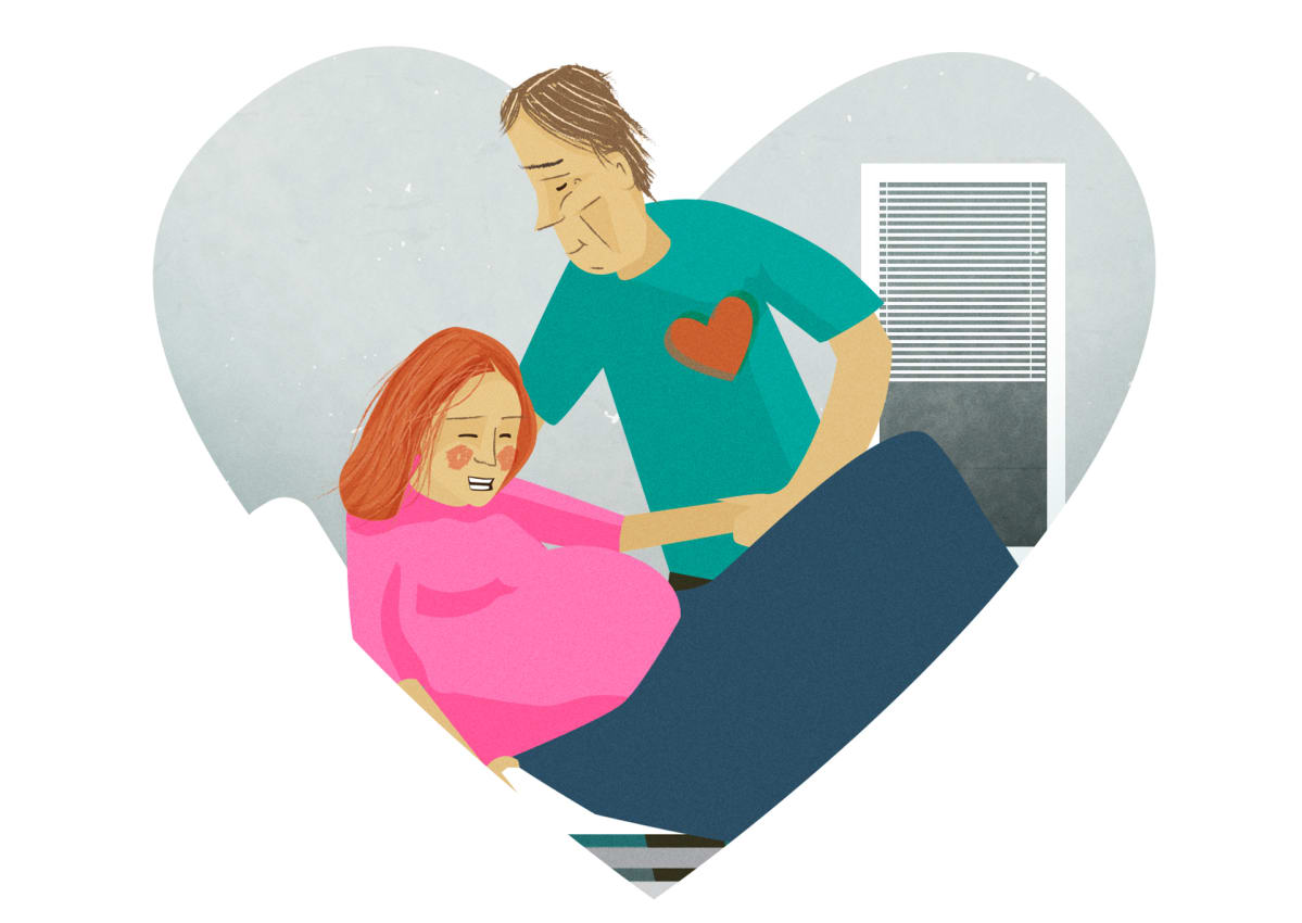 Grafiikka, jossa on rakastava isä naisen kanssa synnytyssalissa.