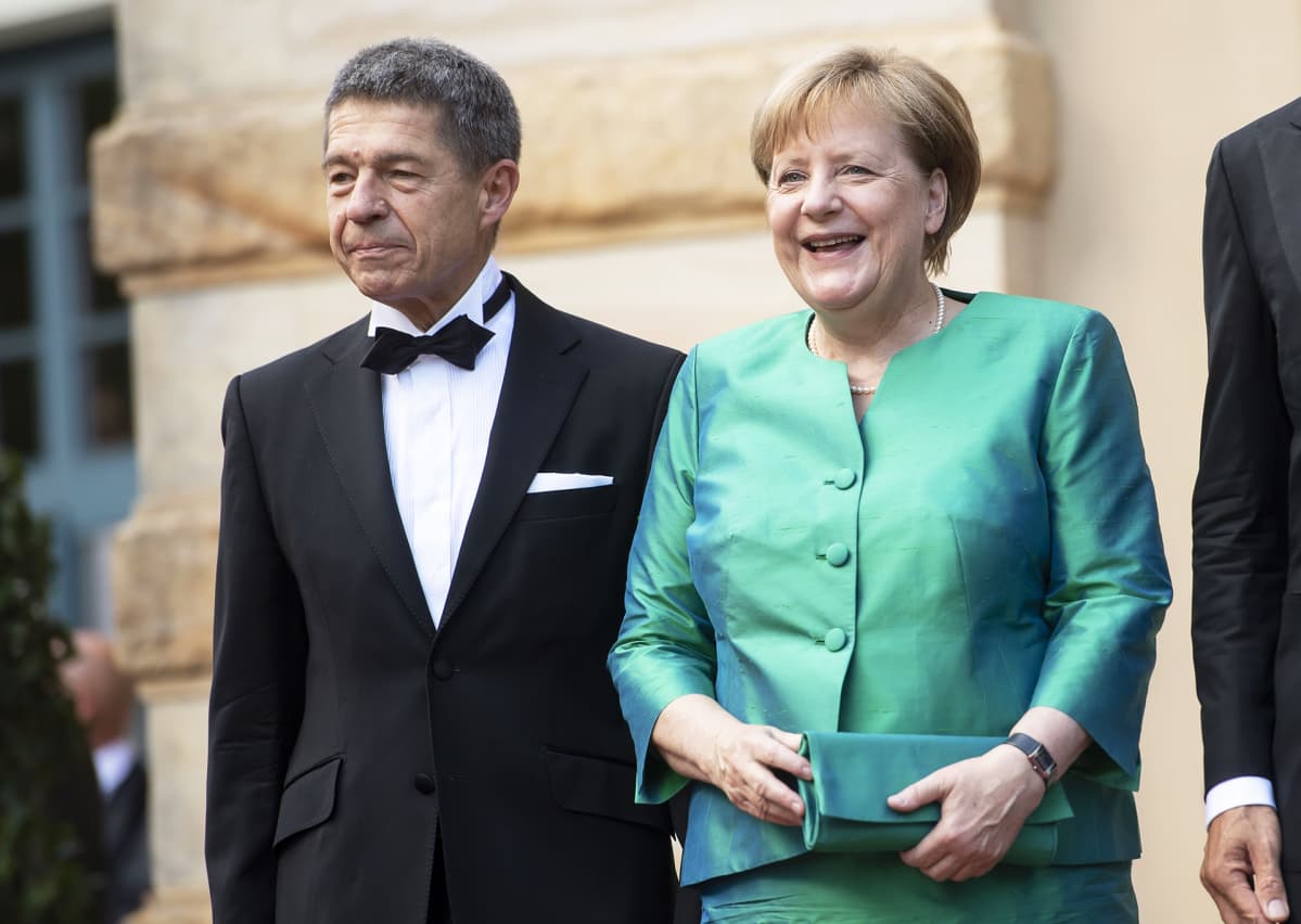 Joachim Sauer ja Angela Merkel.