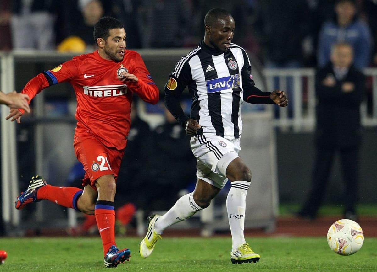 Inter Milan's Walter Gargano (L) fights for the ball with Partizan's Medo (R) during their UEFA Europa League group match in Belgrade, Serbia, 08 November 2012.