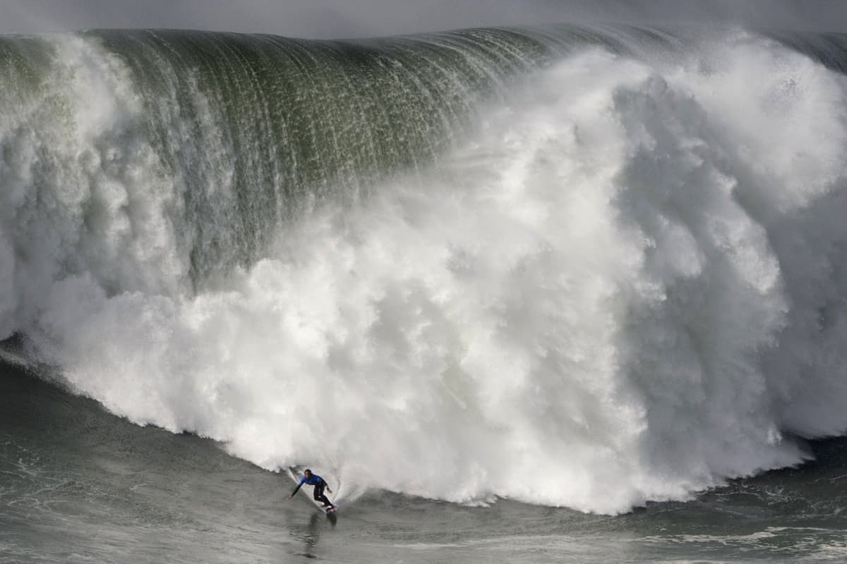 Hawaiian surfer Kai Lenny rides a wave during the big waves Nazare Tow Surfing Challenge in Nazare, on February 11,