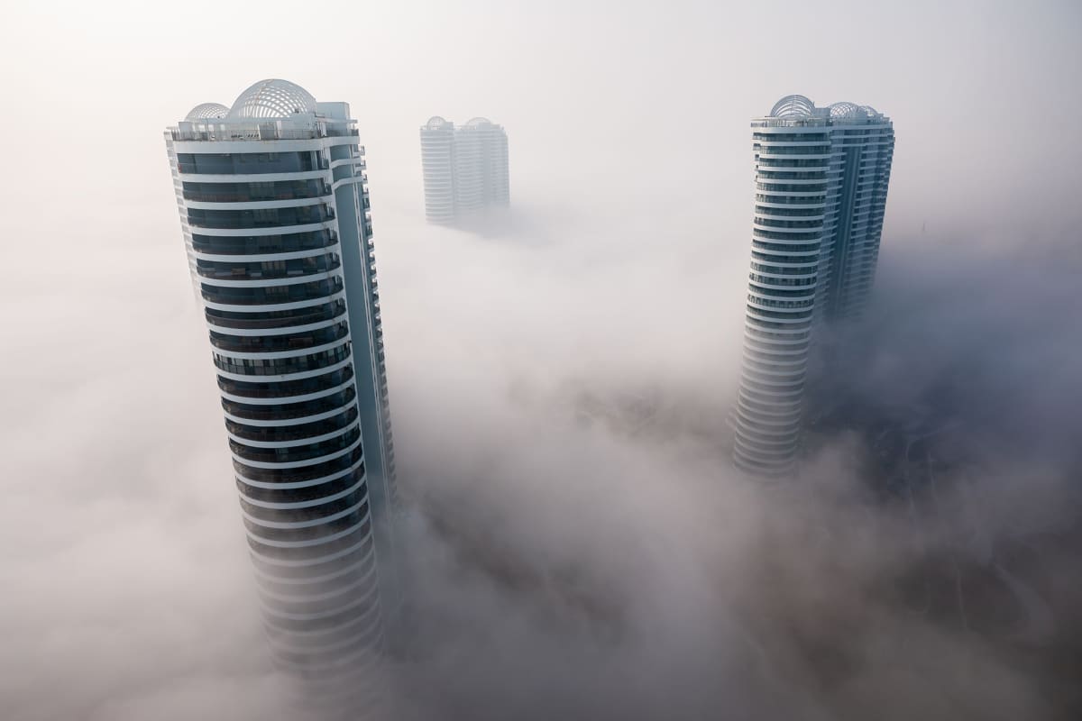 Skyscrapers are enveloped by fog in Huludao city, north-east China's Liaoning province
Fog in downtown Huludao city, Liaoning province, China - 10 Feb 2020
