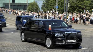 Ihmiset seurasivat Venäjän presidentti Vladimir Putinin saattueen saapumista 16. heinäkuuta.