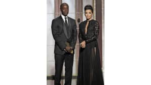 Eva Longoria upeassa mustassa puvussaan yhdessä Don Cheadlen kanssa.