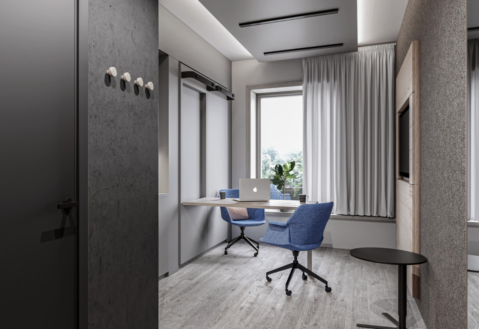 Havainnekuva työtilaksi muutetusta hotellihuoneesta.