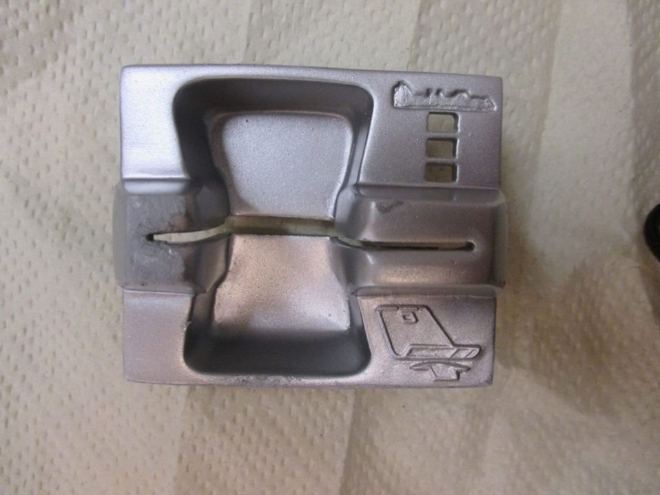Skimmauslaitteen osa.