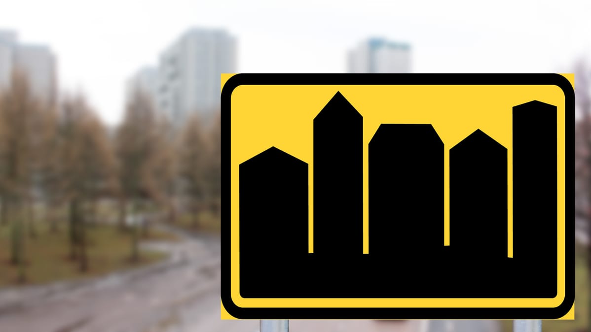 Kuvitteellinen Taajama-alue liikennemerkki