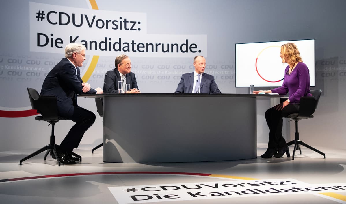 CDU:n puheenjohtajatentissä Norbert Röttgen, Armin Laschet ja Friedrich Merz.