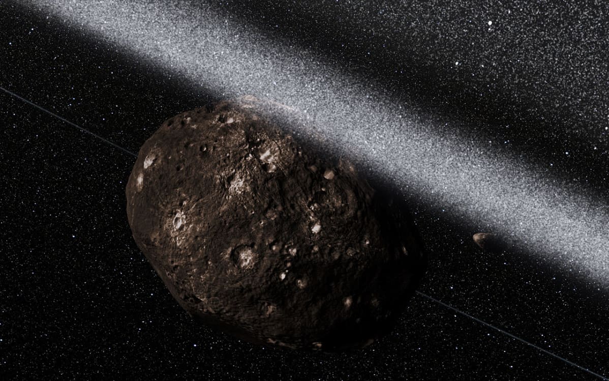 Taiteilijan näkemys siitä, millainen näkymä Chariklo-asteroidia ympäröivien kehien sisäpuolelta saattaa olla.