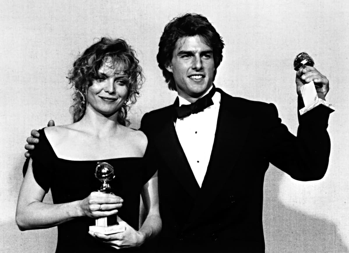 Michelle Pfeiffer ja Tom Cruise Golden Globe -palkinnot kädessään.