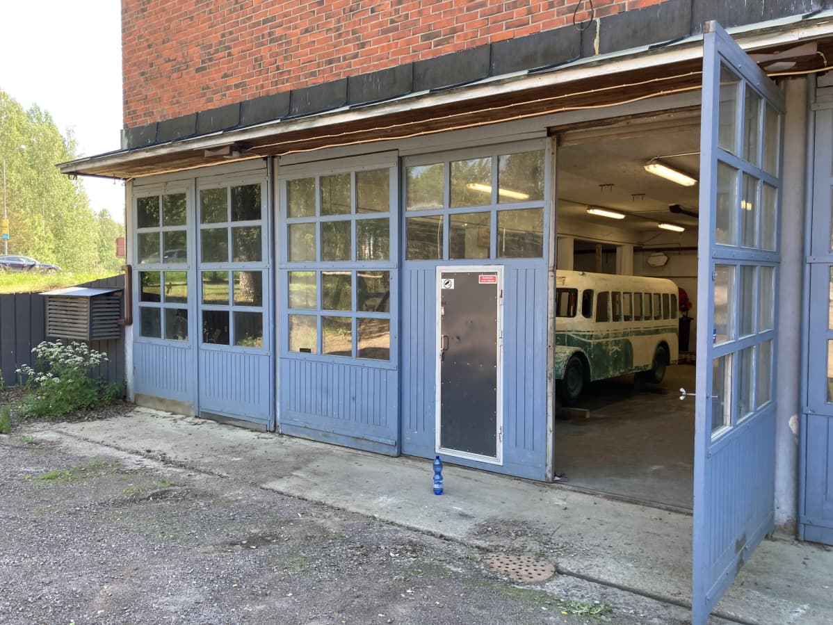 A toy bus peeks out of the garage