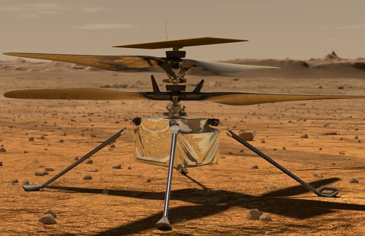 Neljällä jalalla seisova nelilapainen pieni helikopteri.