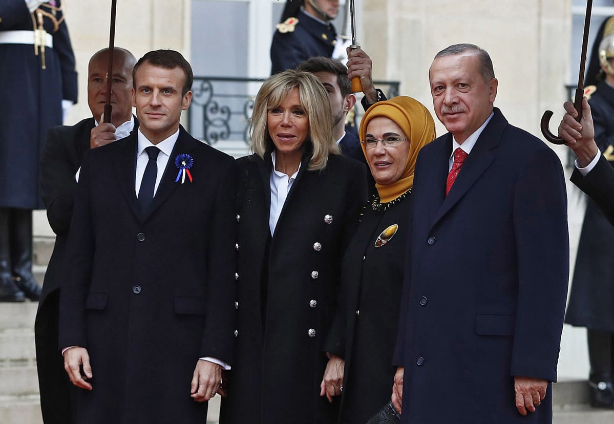 French President Emmanuel Macron (L) and his wife Brigitte Macron (2-L) welcome Turkish President Recep Tayyip Erdogan (R) and his wife Emine Erdogan (2-R) at the Elysee Palace ahead of the international ceremony for the Centenary of the WWI Armistice of 11 November 1918, in Paris, France, 11 November 2018. World leaders have gathered in France to mark the 100th anniversary of the First World War Armistice with services taking place across the world to commemorate the occasion.