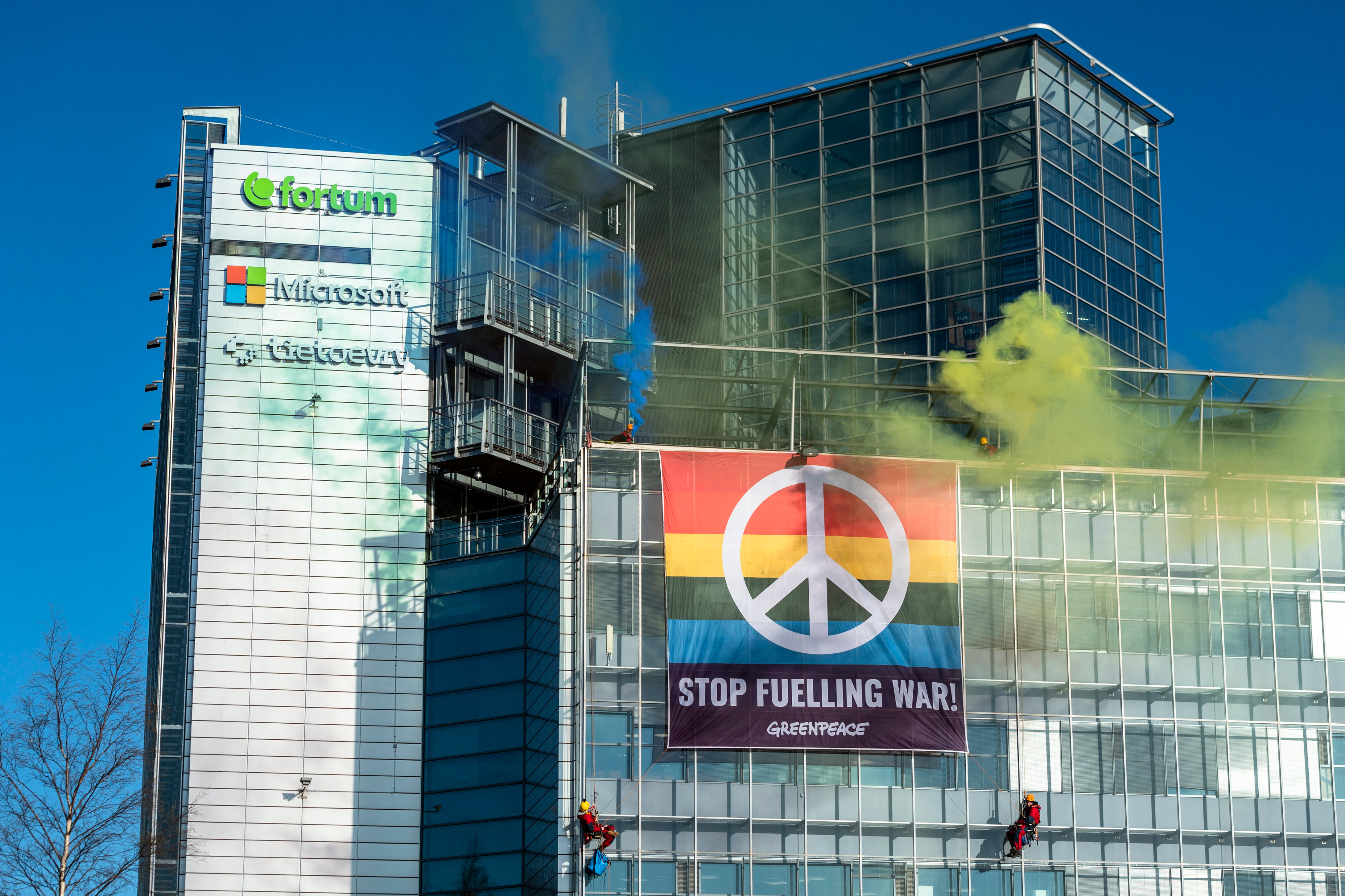 Greenpeace activists hung an anti-war flag at the headquarters of the power company Fortum