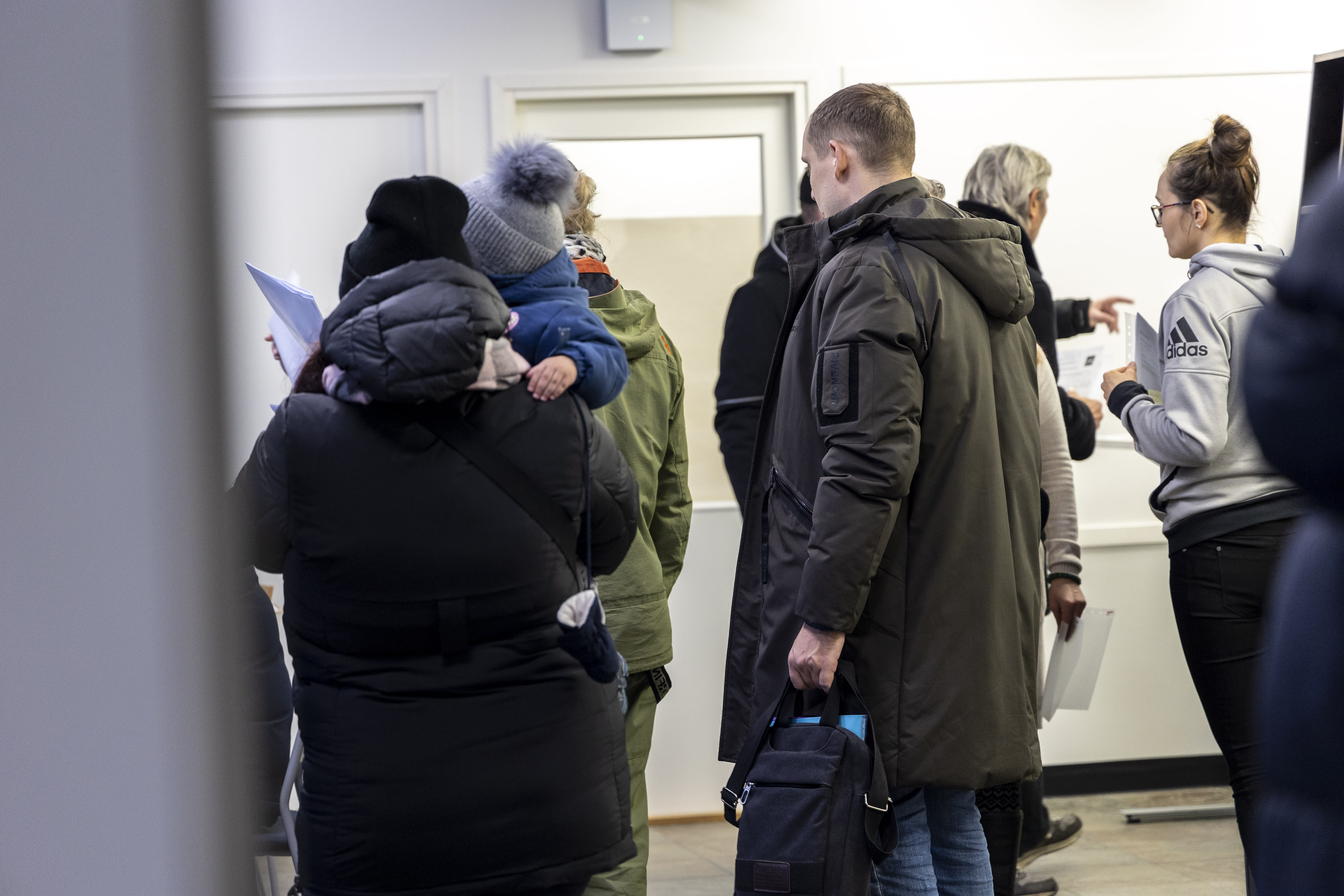 Government negotiators examine the use of food vouchers and cuts in refugee quotas as Finland tries to save money on immigration