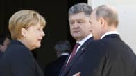 Venäjän presidentti Vladimir Putin tapasi pikaisesti Ukrainan vastavalitun presidentin Petro Porošenkon Normandian maihinnousun 70-vuotismuistojuhlien kulisseissa. Vasemmalla Saksan liittokansleri Angela Merkel.