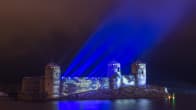 15th century three-tower castle of Olavinlinna illuminated in honour of Finland's 100th year of independence, in Savonlinna, Finland.