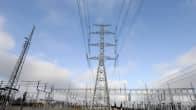 Fingrid's EstLink 2 transformer station in Porvoo, with many electrical lines against a partly cloudy blue sky.