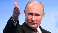 Vladimir Putin käsi ojossa.
