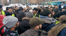 Demonstrating Iraqi asylum seekers listen to details about a meeting with Immigration Service officials at Helsinki Railway Square on Monday February 27, 2017.
