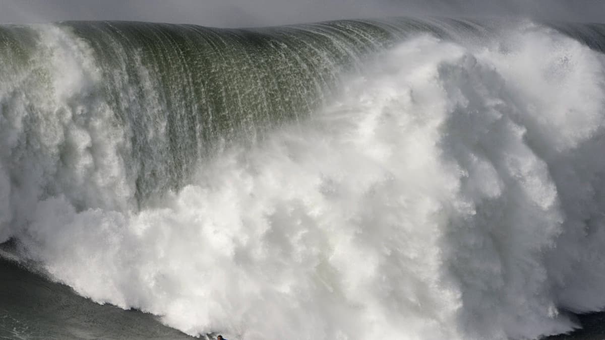 Hawaiian surfer Kai Lenny rides a wave during the big waves Nazare Tow Surfing Challenge in Nazare, on February 11, 