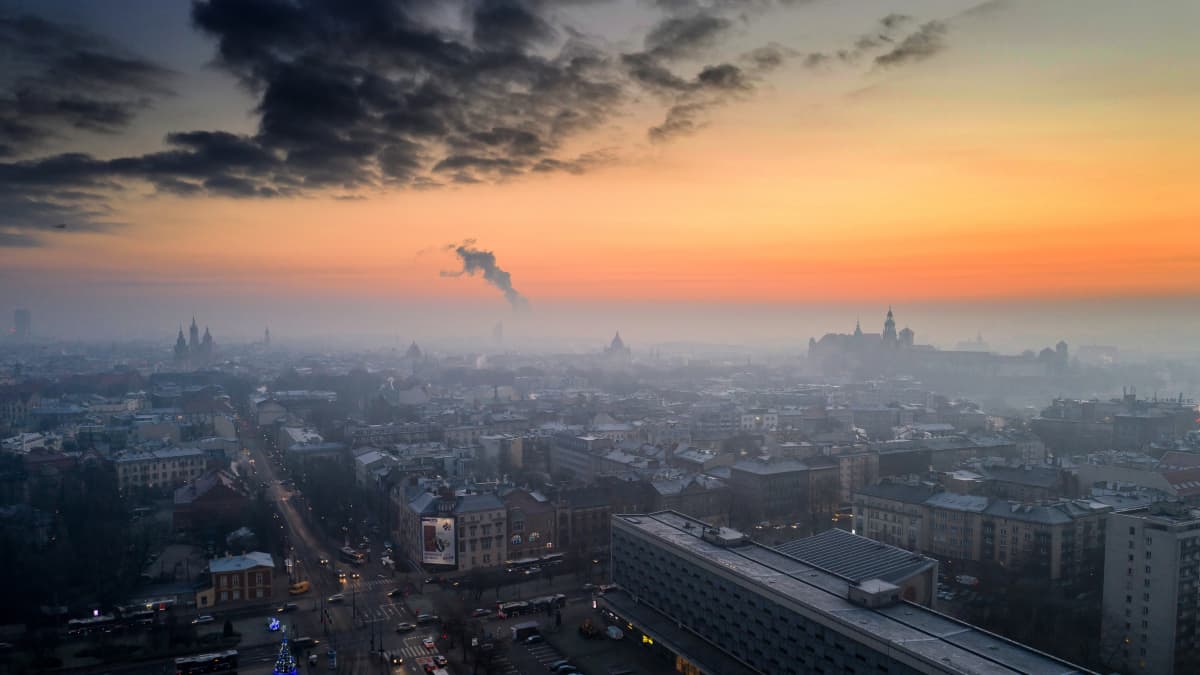 An aerial picture taken with a drone shows a wispy blanket of smog over Krakow, southern Poland, 11 January 2021. Despite movement restrictions implemented to stem the spreading of the coronavirus disease (COVID-19) pandemic, air pollutio​n levels across Krakow still remain relatively high. EPA-EFE/LUKASZ GAGULSKI POLAND OUT
