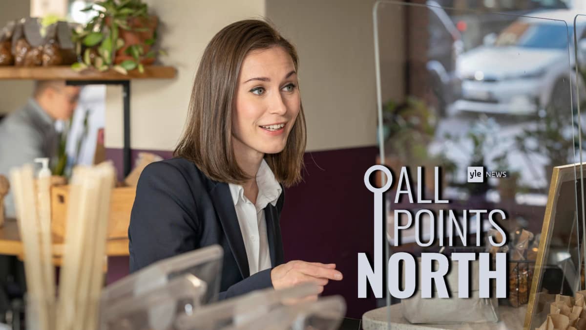 Prime Minister Sanna Marin (SDP) photographed at a cafe in Helsinki, featuring the All Points North podcast logo.