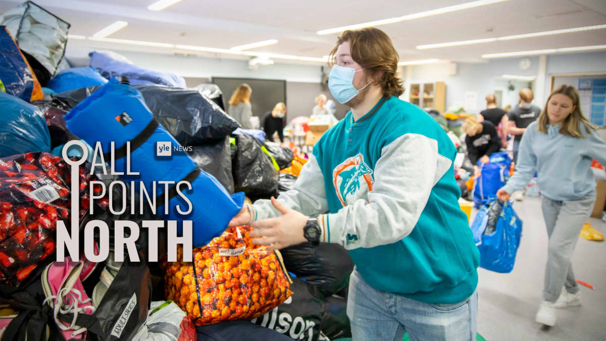 Students in Joensuu sorting donations headed to the Ukraine region, featuring the All Points North podcast logo.