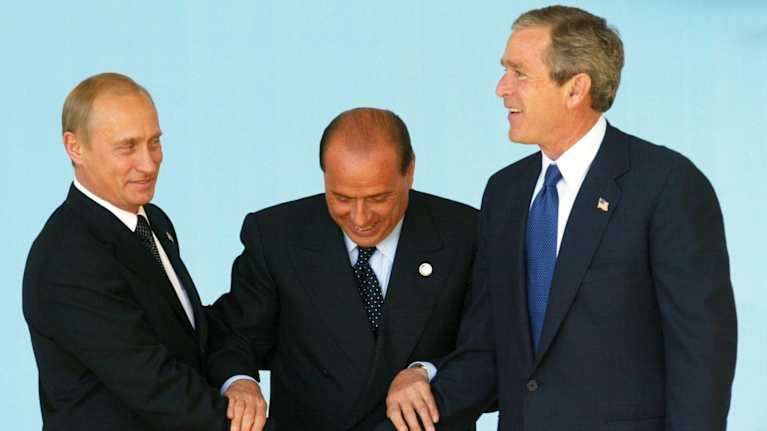Vladimir Putin, Silvio Berlusconi and George W. Bush.