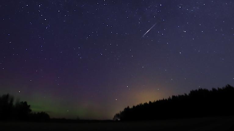 A starry sky and shooting star.