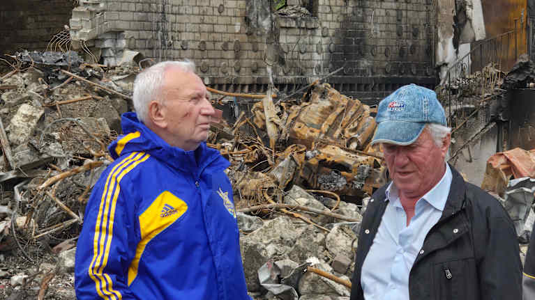 Ivan Fedorenko, Marhalivka resident, stands near his destroyed home.