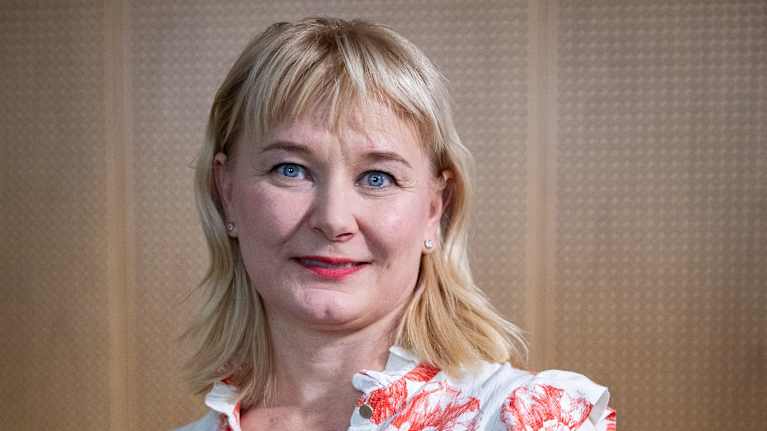 Pauliina Mattila-Holappa sits and looks at the camera.