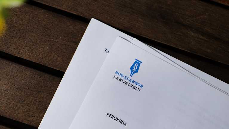 Legal letters outlining business succession on a sunny table.