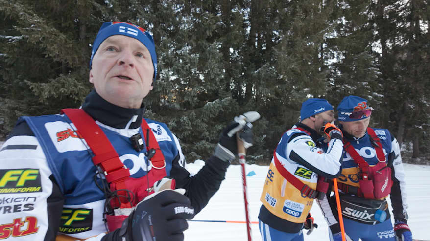 Image 14: A technician whispers his opinion to waxing chief Heikki Tonteri. Mika Venäläinen stands nearby.