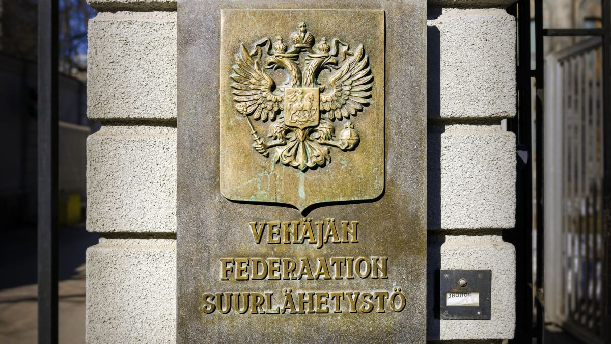 A closeup of a sign outside the Russian Embassy in Helsinki.