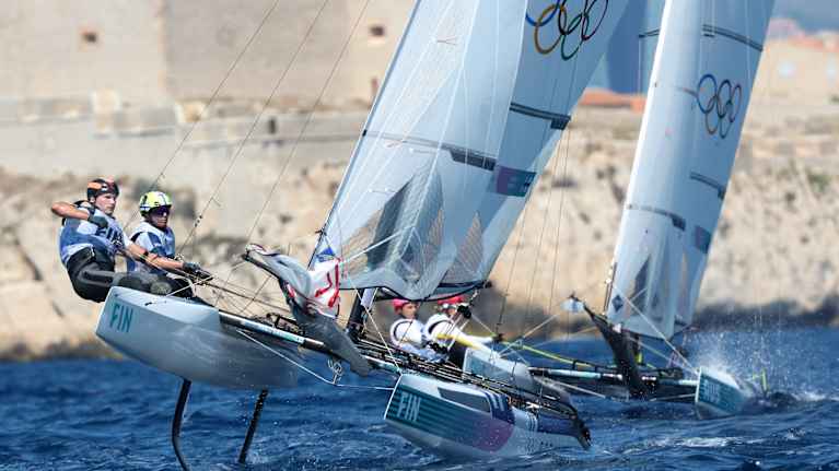 Image 21: Sailors Akseli Keskinen and Sinem Kurtbay on the opening day of the Olympic regatta.
