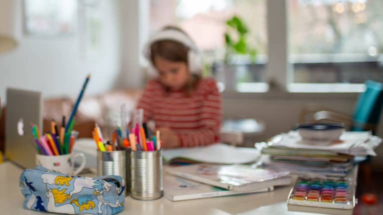 A child who does homework.