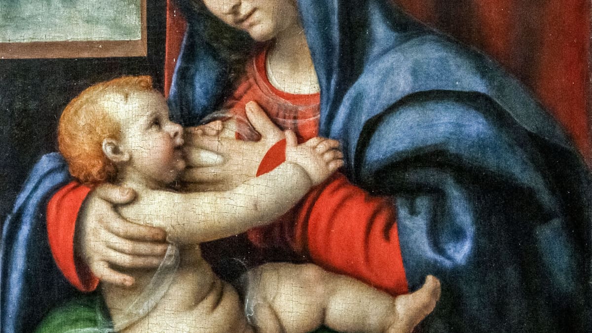 Renessassin aikainen värikäs taulu, jossa Madonna imettää vauvaa joka on aseteltu hänen syliinsä vihreälle tyynylle.