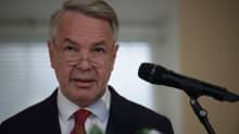 Closeup of Pekka Haavisto speaking into a microphone.