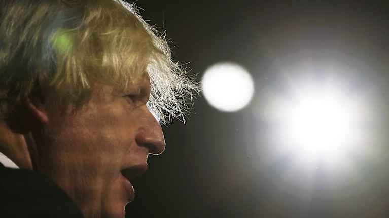 Backlit side profile of Boris Johnson.