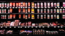Meat products on a refrigerated display at a Prisma hypermarket in Helsinki.