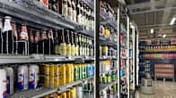 A store shelf full of beer.