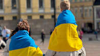 Senate Square in Helsinki. Action “United for Ukraine” for the Independence Day of Ukraine 24.08.2024.   A family wrapped in Ukrainian flags.